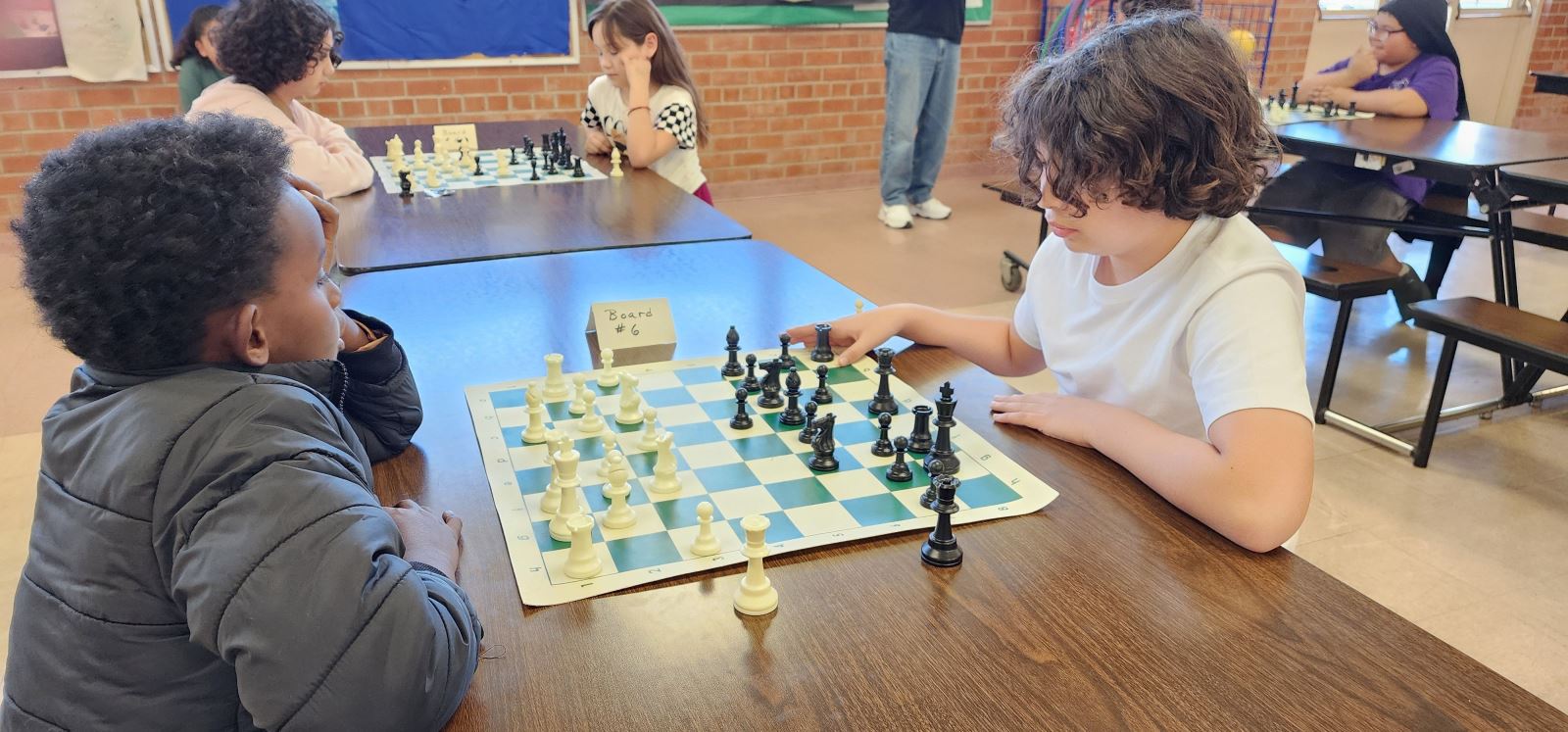 Two boys play chess