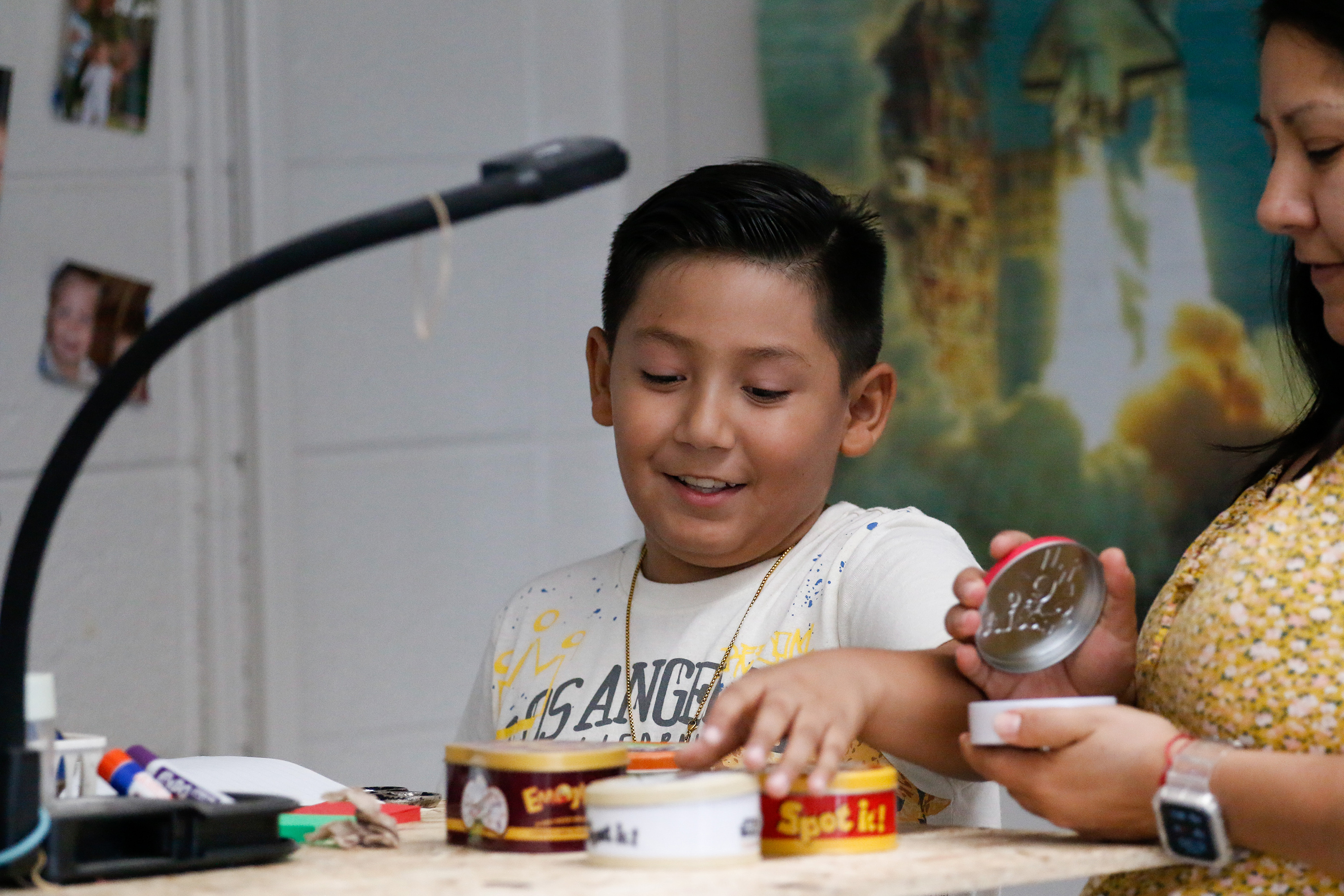 A little boy works on an art project