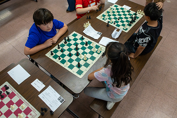 Overhead view of students playing chess